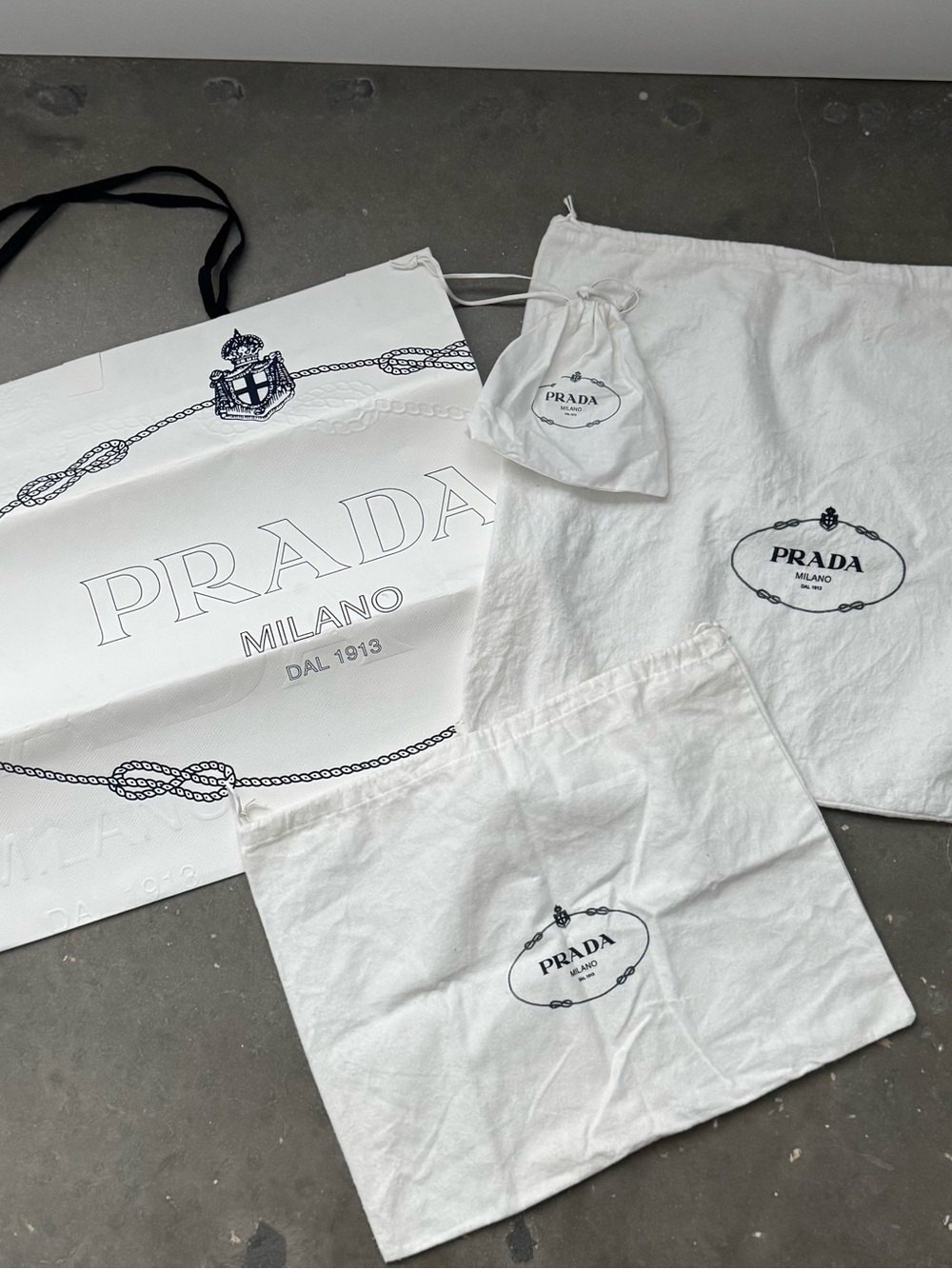 Prada Shopping Bag w/three dust cover bags.
